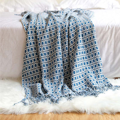 Coperta per divano lavorata a maglia Ownkoti con nappe