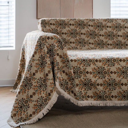 Copridivano con nappa in jacquard a fiori di prugna
