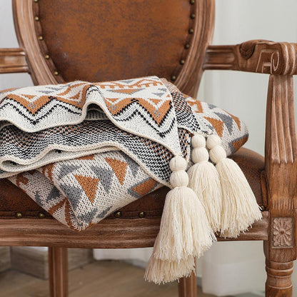 Coperta lavorata a maglia con nappe e motivo a forma di Ownkoti