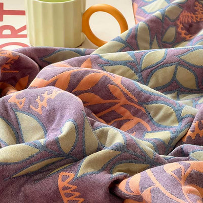 Trapunta reversibile in cotone con foglie verdi e arancioni