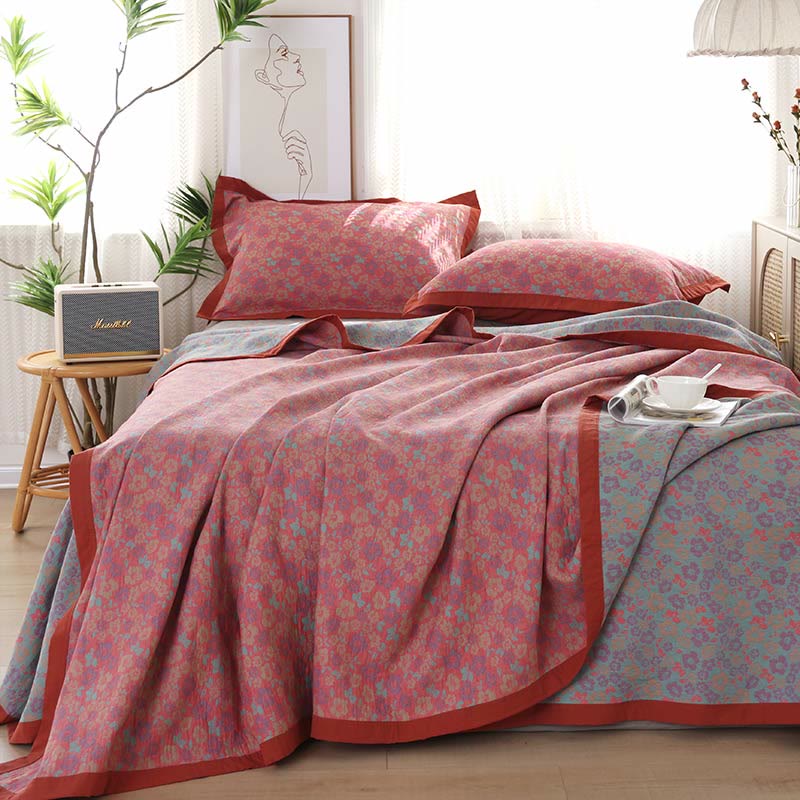 Trapunta reversibile in garza di cotone jacquard floreale