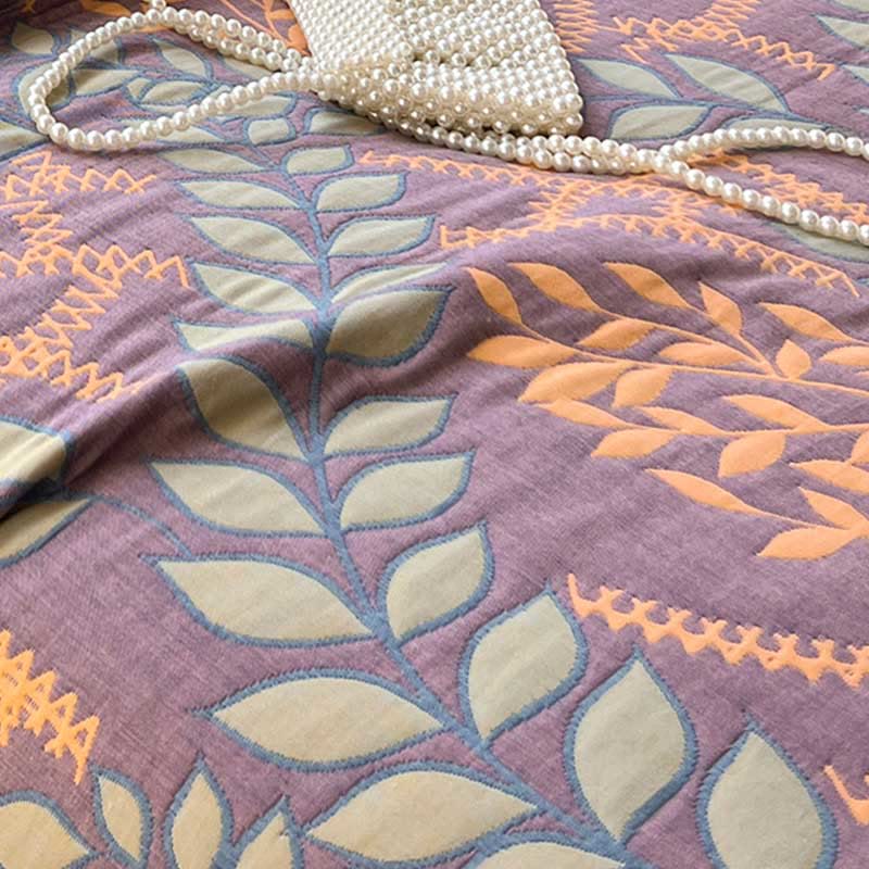 Trapunta reversibile in cotone con foglie verdi e arancioni