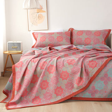 Trapunta reversibile in garza di cotone con motivo patchwork a fiori