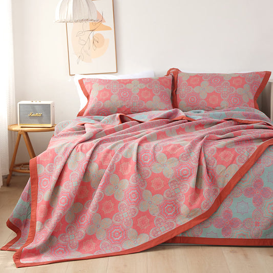 Trapunta reversibile in garza di cotone con motivo patchwork a fiori