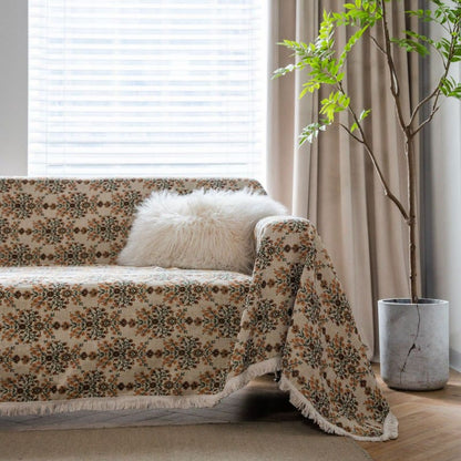 Copridivano con nappa in jacquard a fiori di prugna
