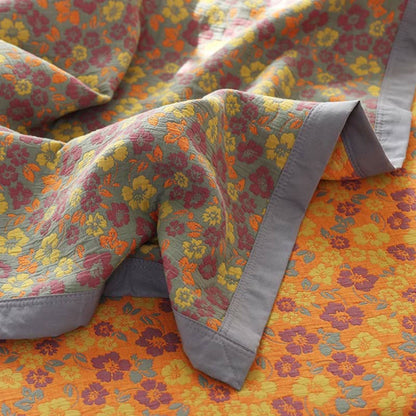 Trapunta reversibile in garza di cotone jacquard floreale
