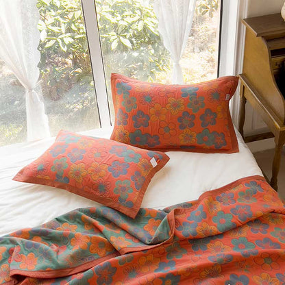 Trapunta reversibile in cotone jacquard con splendido motivo floreale