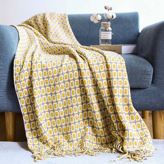 Coperta per divano lavorata a maglia Ownkoti con nappe