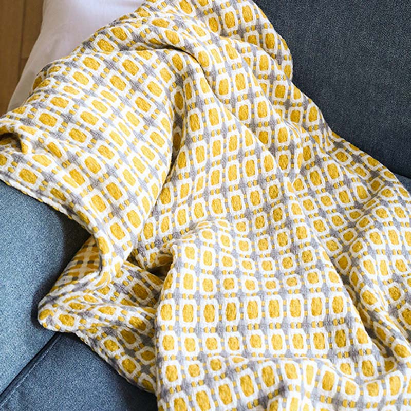 Coperta per divano lavorata a maglia Ownkoti con nappe