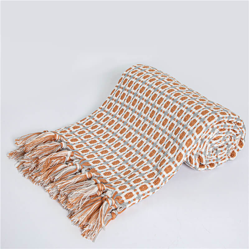 Coperta per divano lavorata a maglia Ownkoti con nappe