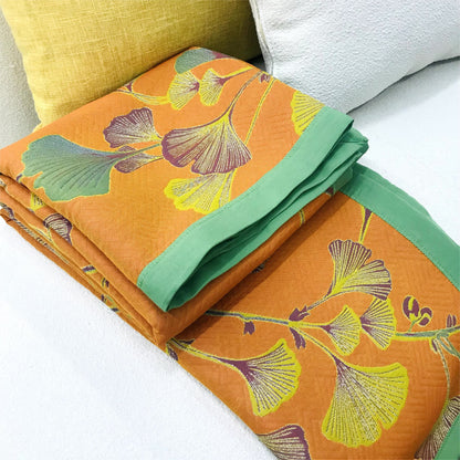 Trapunta reversibile in cotone jacquard con foglie di ginkgo