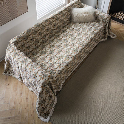 Copridivano con nappa in jacquard a fiori di prugna