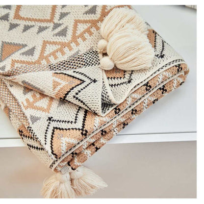 Coperta lavorata a maglia con nappe e motivo a forma di Ownkoti