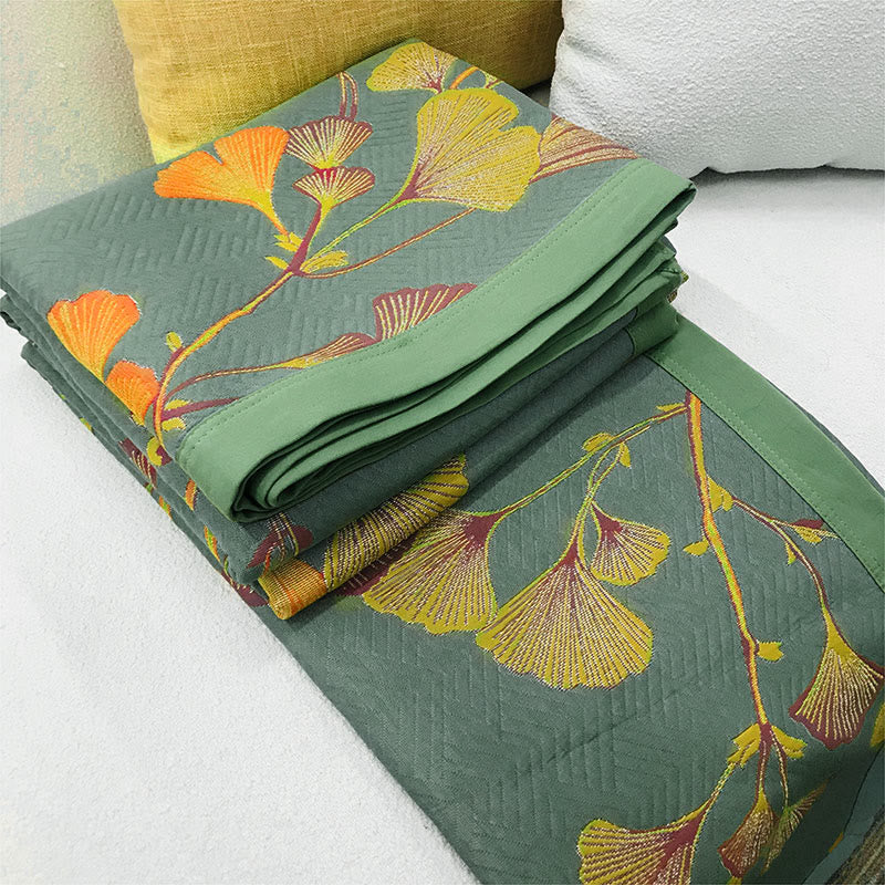 Trapunta reversibile in cotone jacquard con foglie di ginkgo